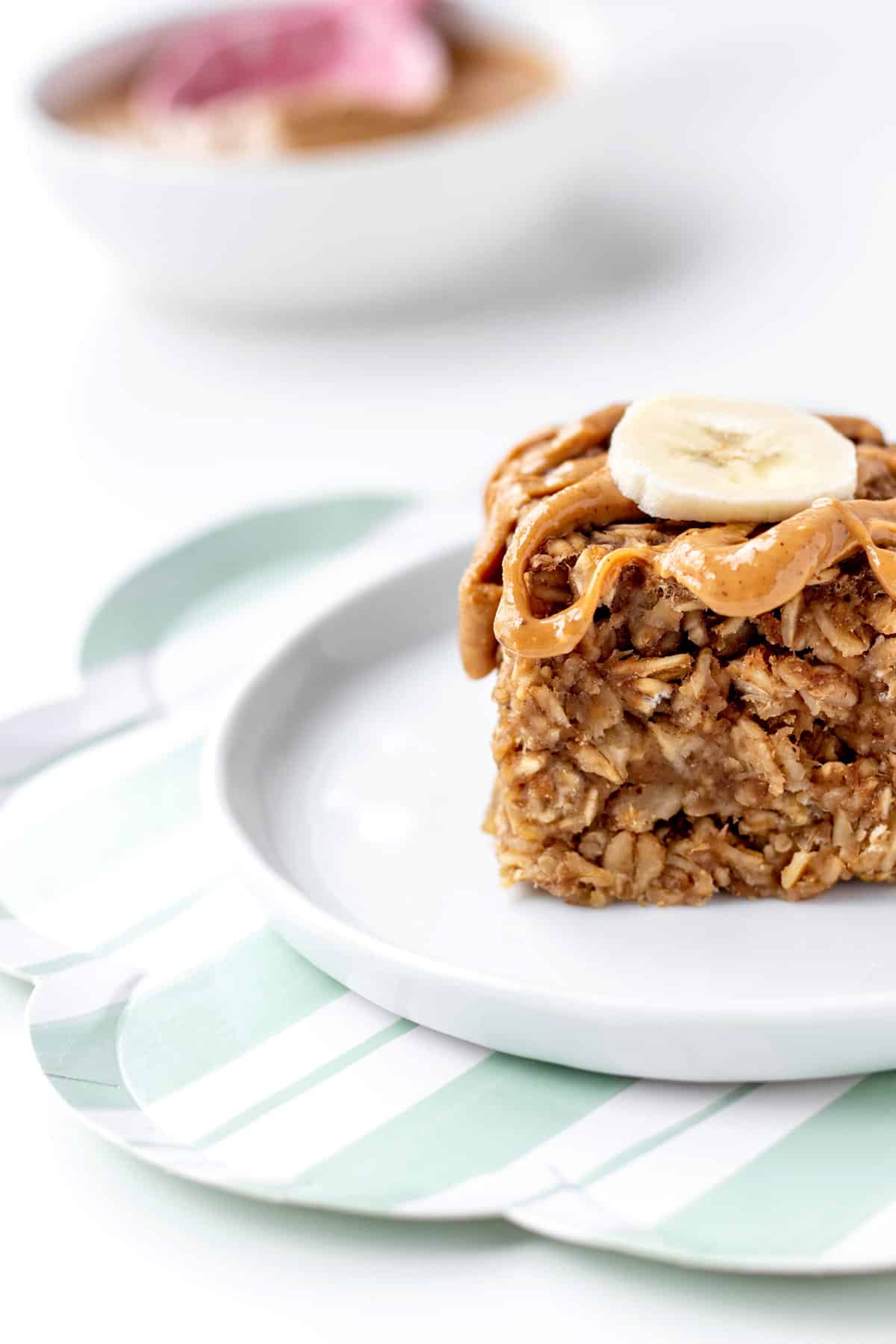 Close up of a 3-ingredient banana oatmeal bar on a white plate.