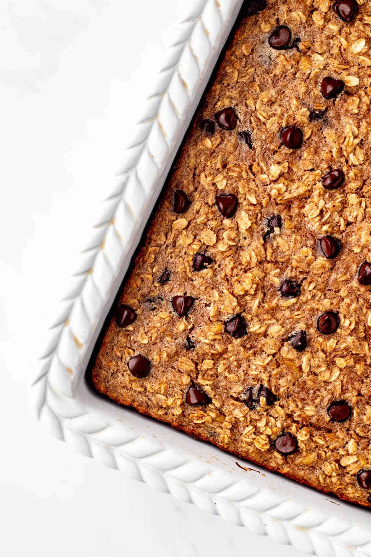 An up close image of the chocolate chip baked oats in a baking dish.