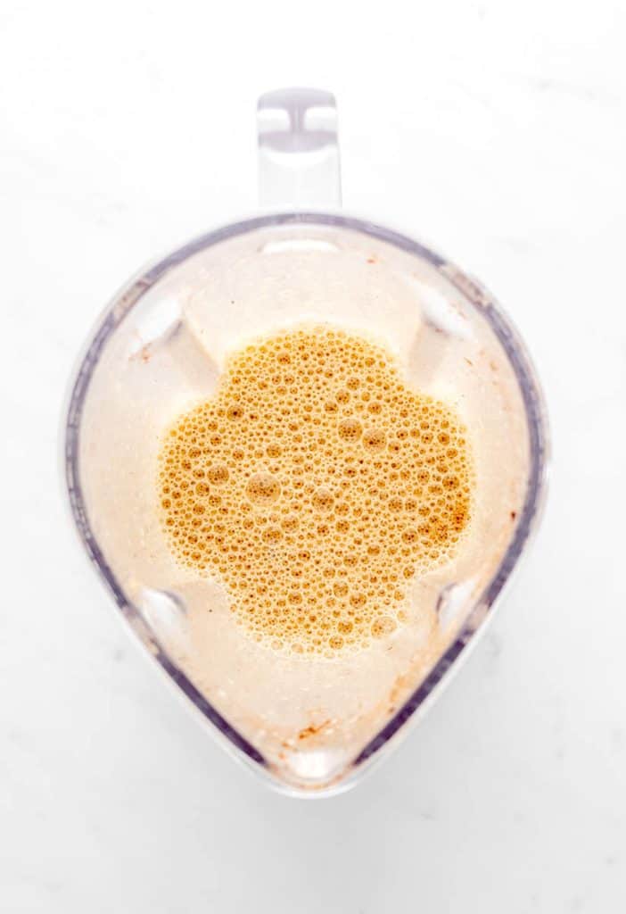 The banana French toast mixture blended together in a blender.