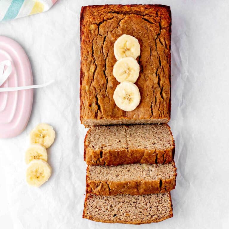 A loaf of baby banana bread cut into slices.