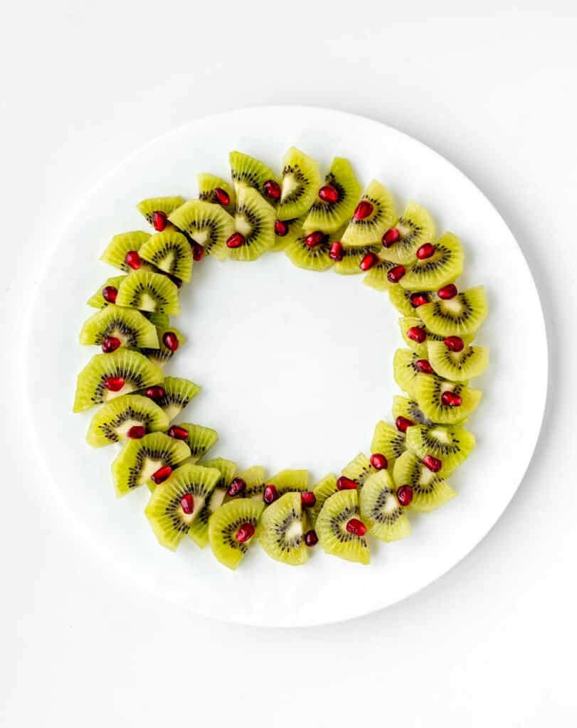 Pomegranates decorating the Christmas fruit wreath.