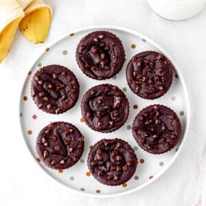 3-ingredient banana brownies on a plate topped with chocolate chips.