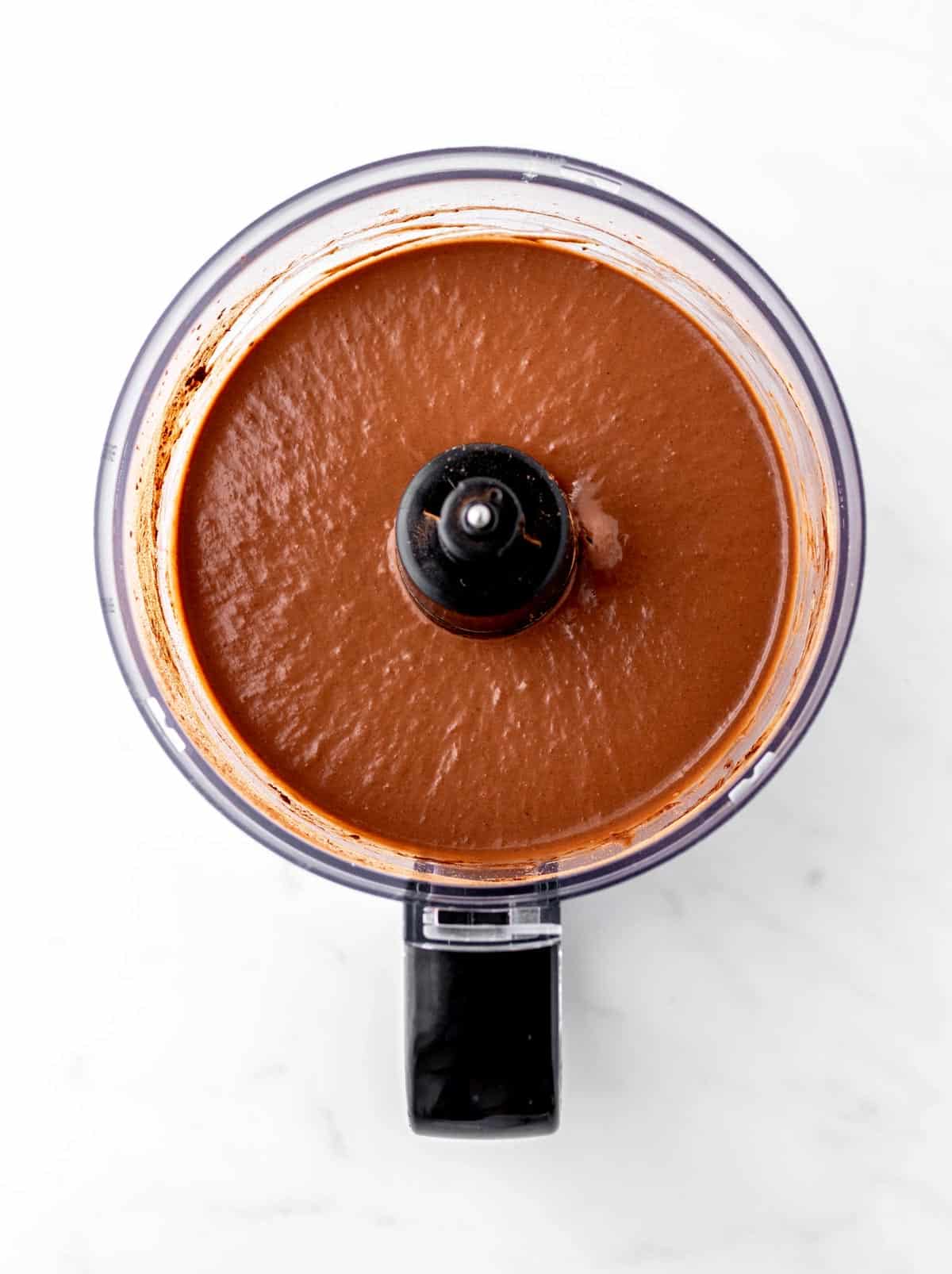 Cocoa powder, peanut butter and bananas mixed together in a food processor.