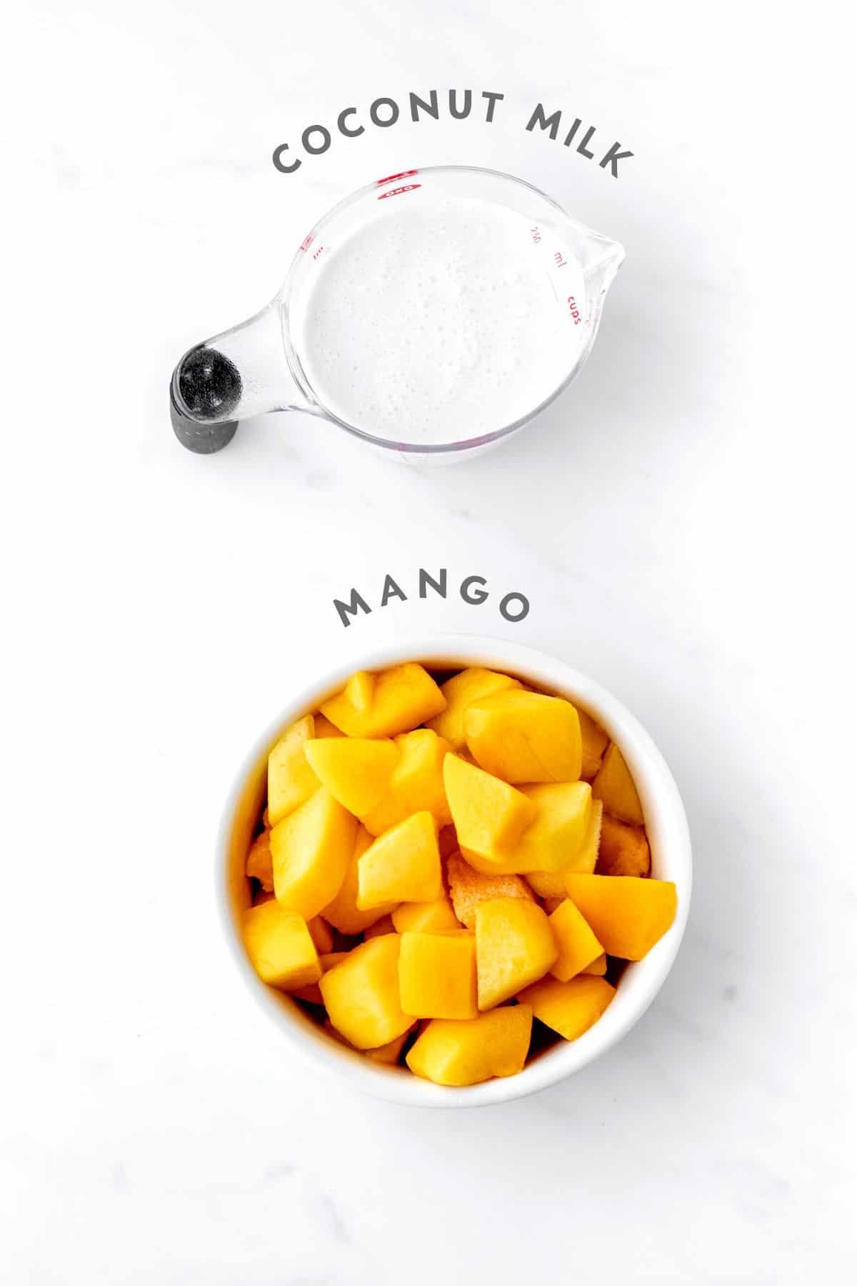 A bowl of mango and coconut milk to make popsicles for toddlers.