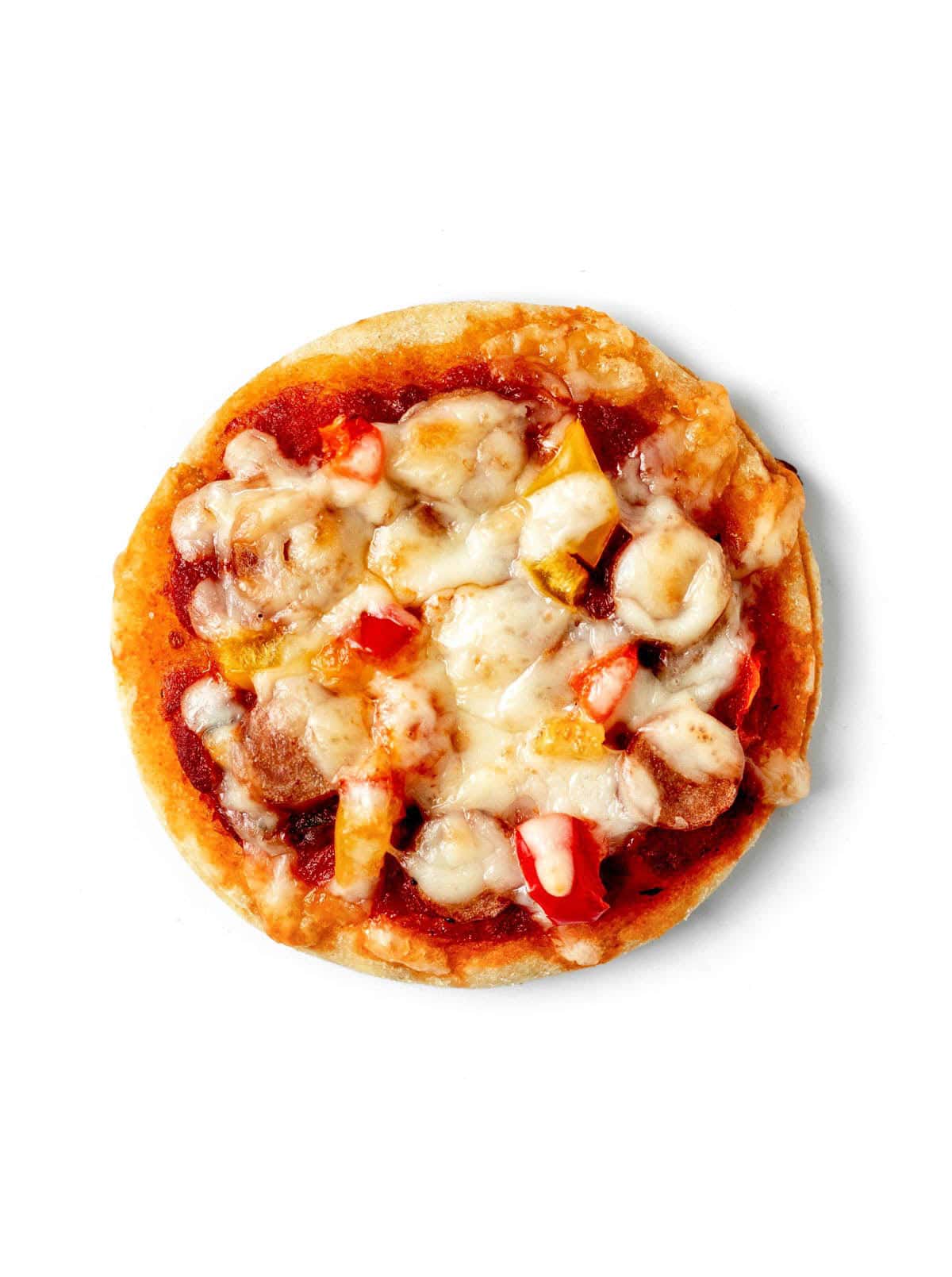 A healthy air fryer mini pizza on a white background.
