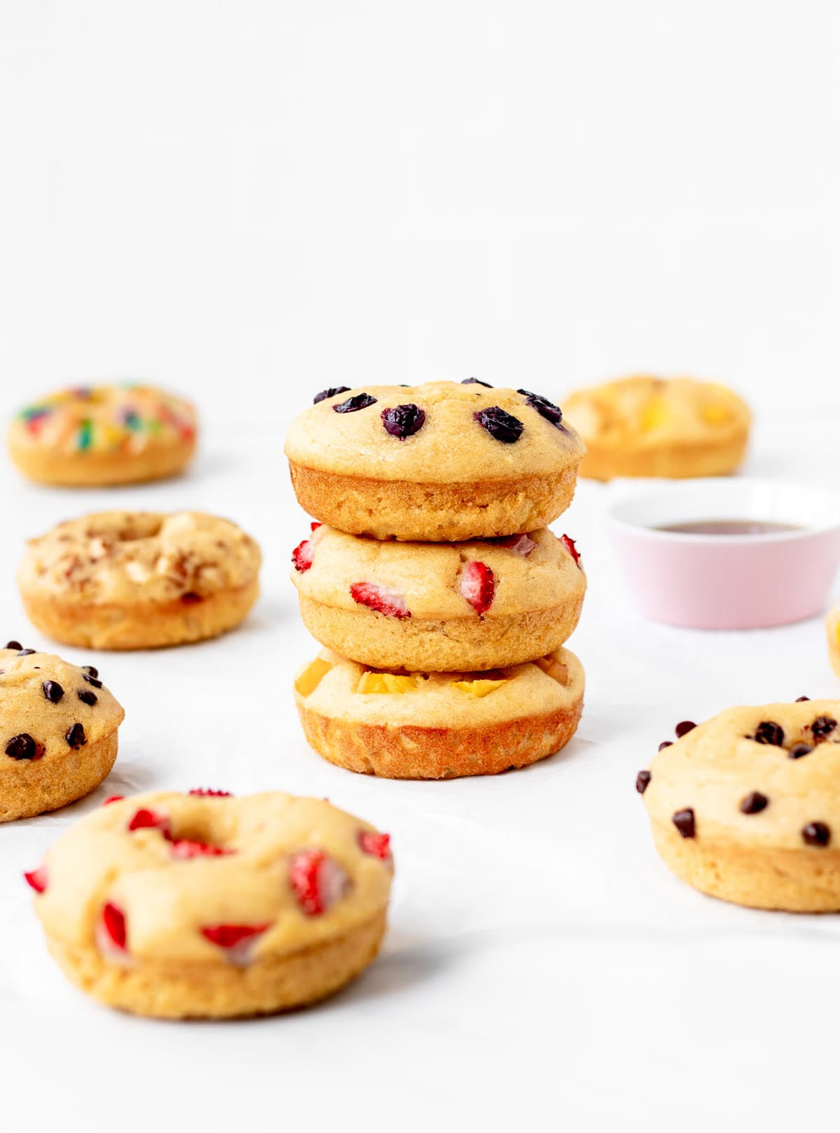 Three pancake donuts stacked on top of each other.