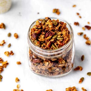 Pumpkin flax seed granola in a mason jar.