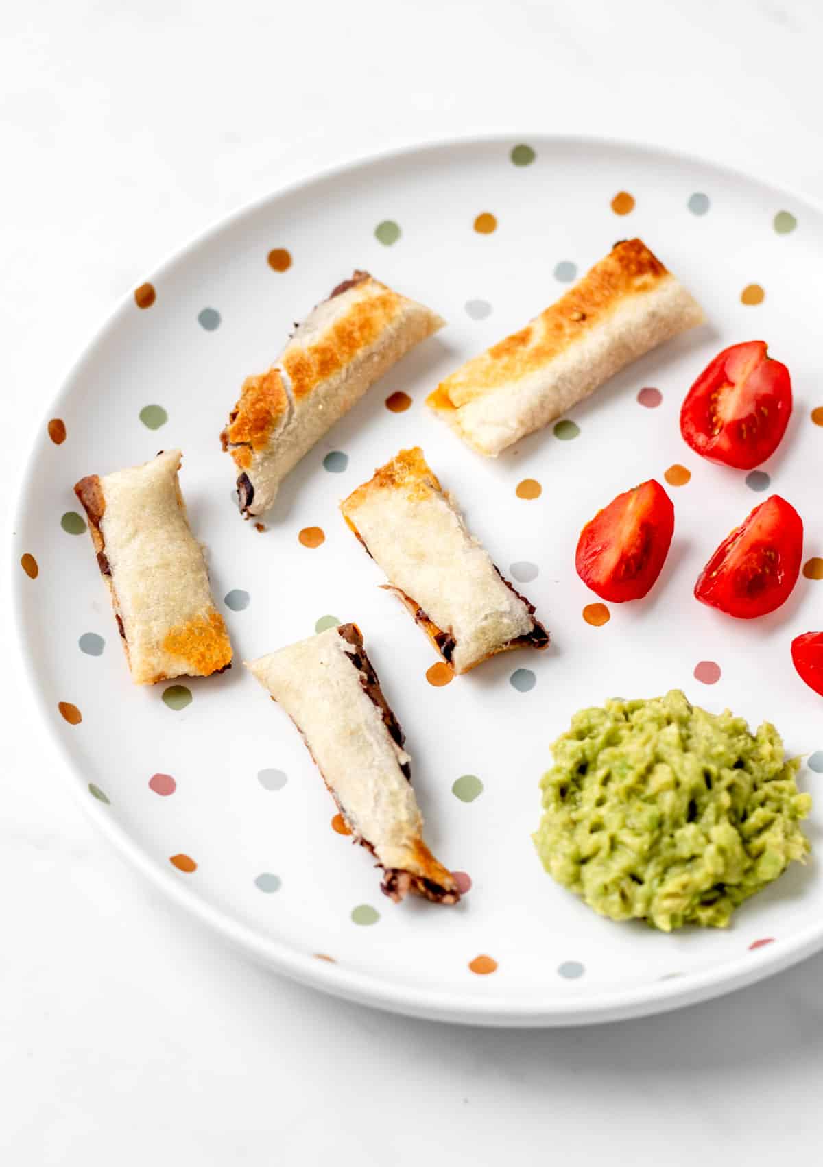 Strips of black bean and cheese quesadillas for baby led weaning.