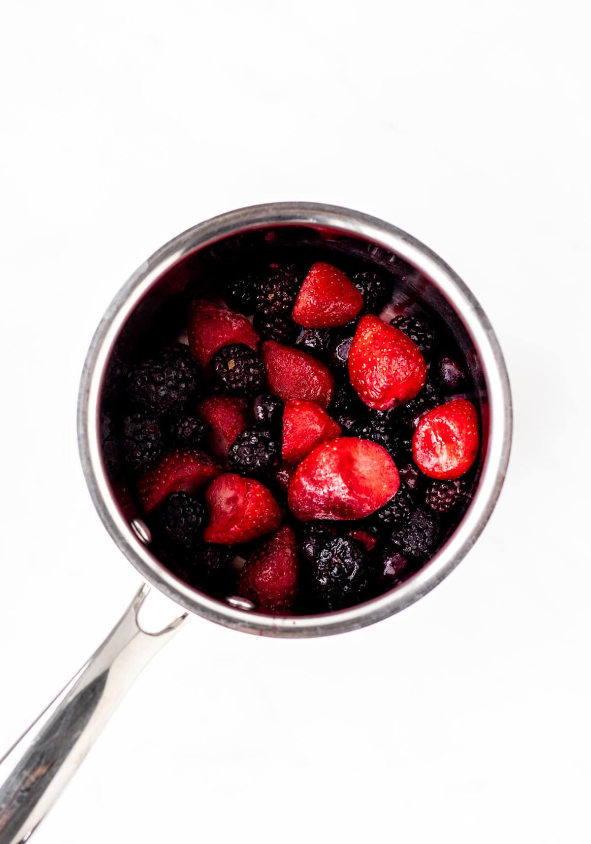 Frozen berries in small pot.