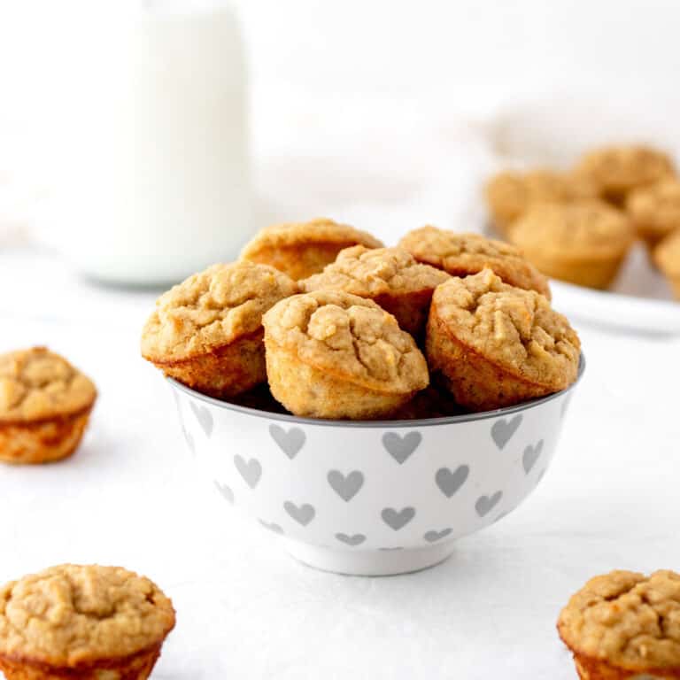 Almond flour banana bread muffins in a heart bowl.