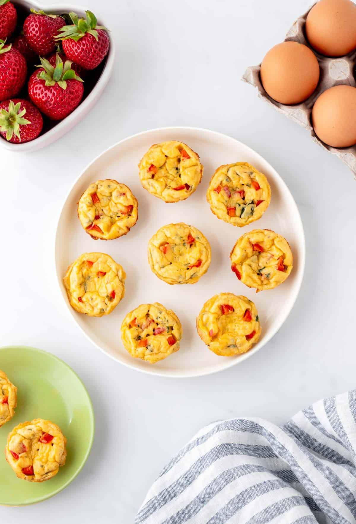 Mini egg bites on a white plate.