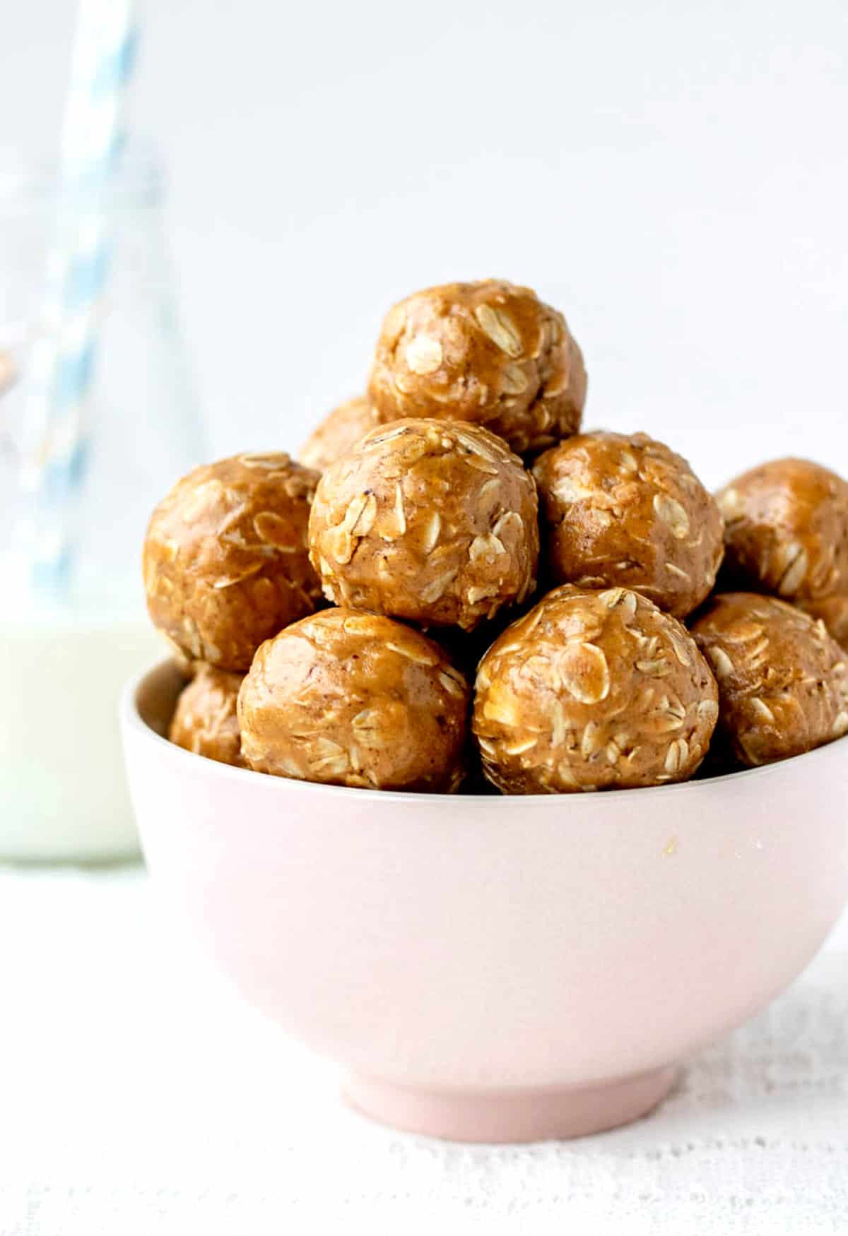 3 ingredient peanut butter oatmeal energy balls in a bowl.