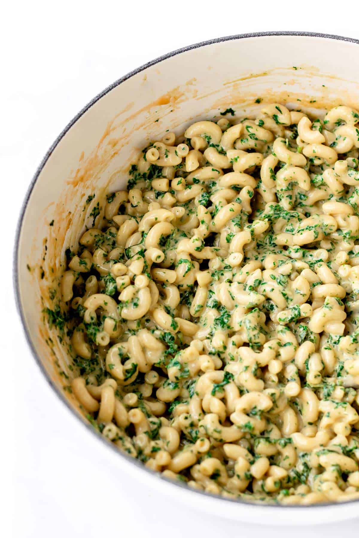 Kale mac and cheese in a large pot.