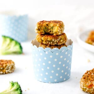 A stack of chickpea veggie patties in a polka dotted serving cup.
