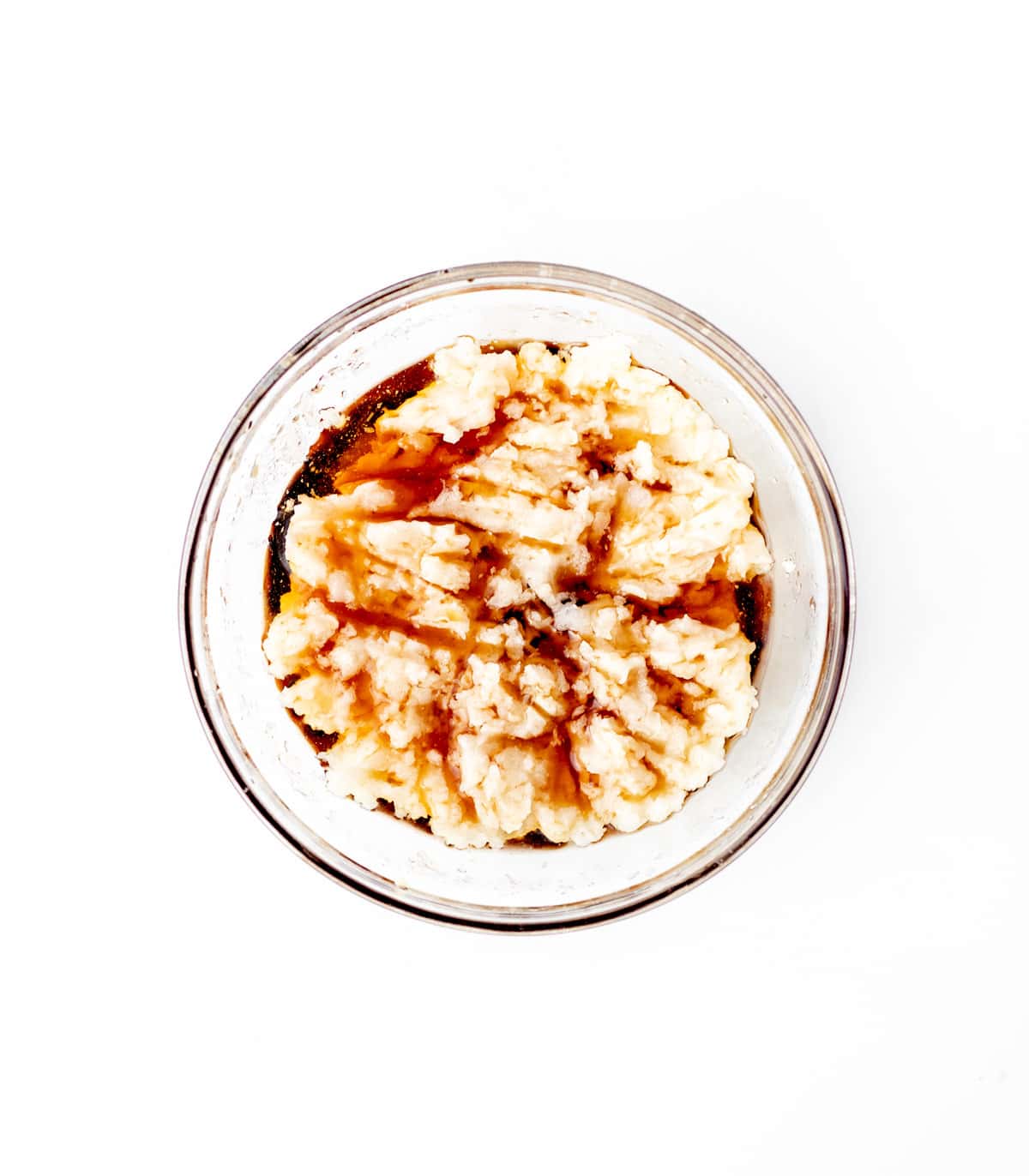 Mixing the maple syrup, coconut oil, water and vanilla in a small bowl.