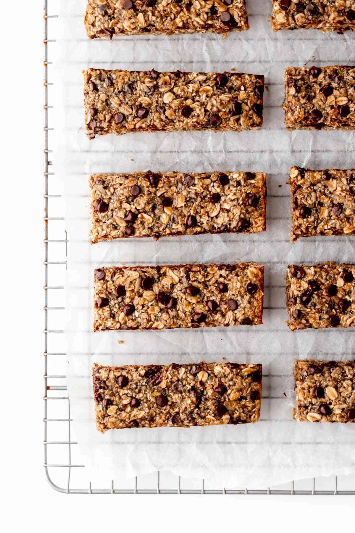 Nut free granola bars on a cooling rack lined with parchment paper.