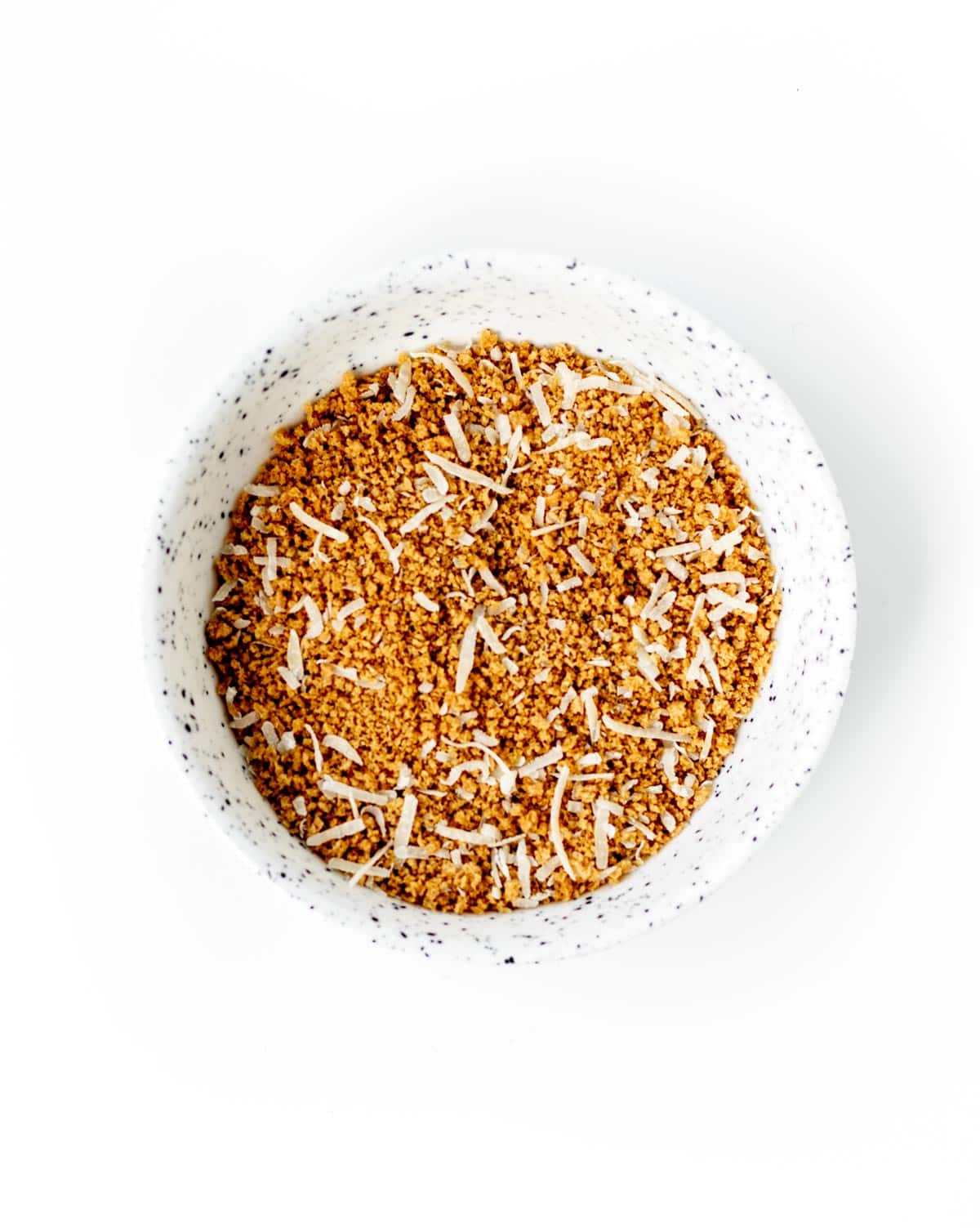 The breadcrumbs and parmesan cheese in a small bowl.