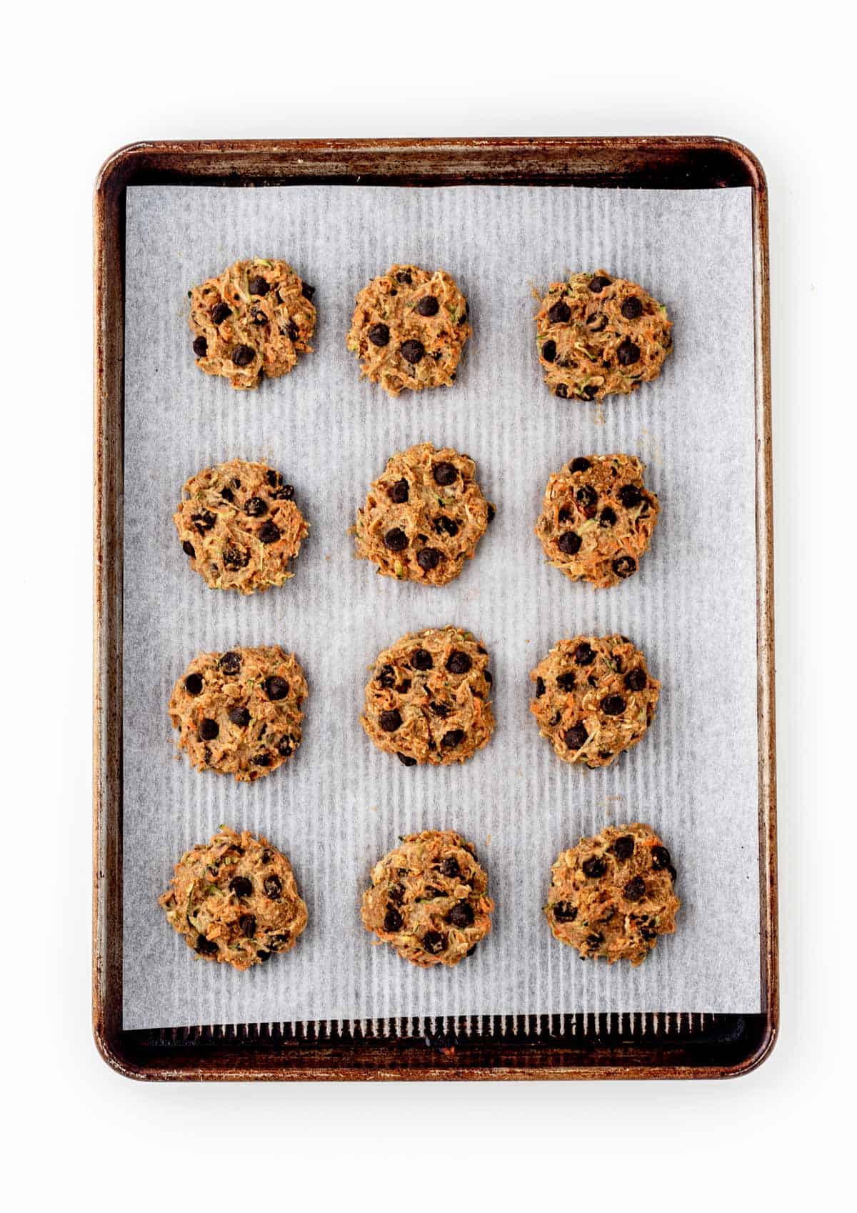 Baked cookies with hidden veggies on a baking sheet lined with parchment paper.