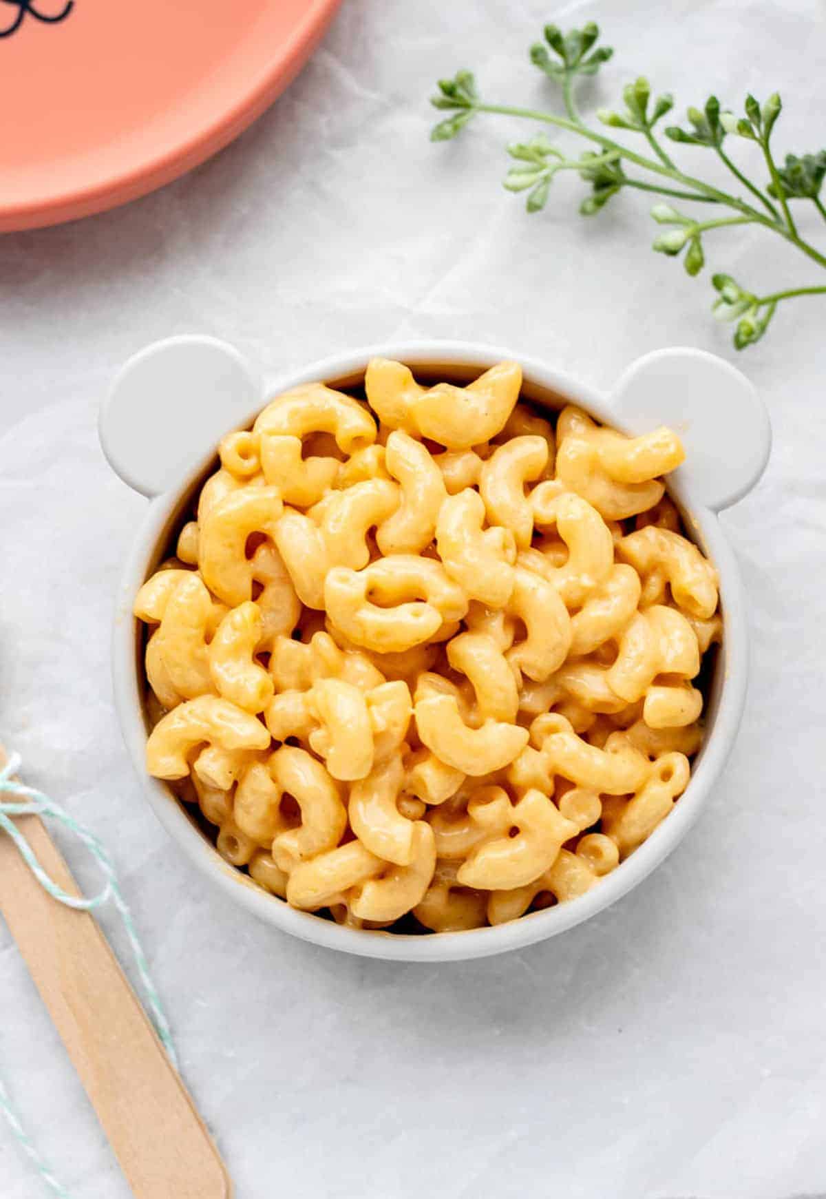 5-ingredient mac and cheese in a small white bowl on a table.