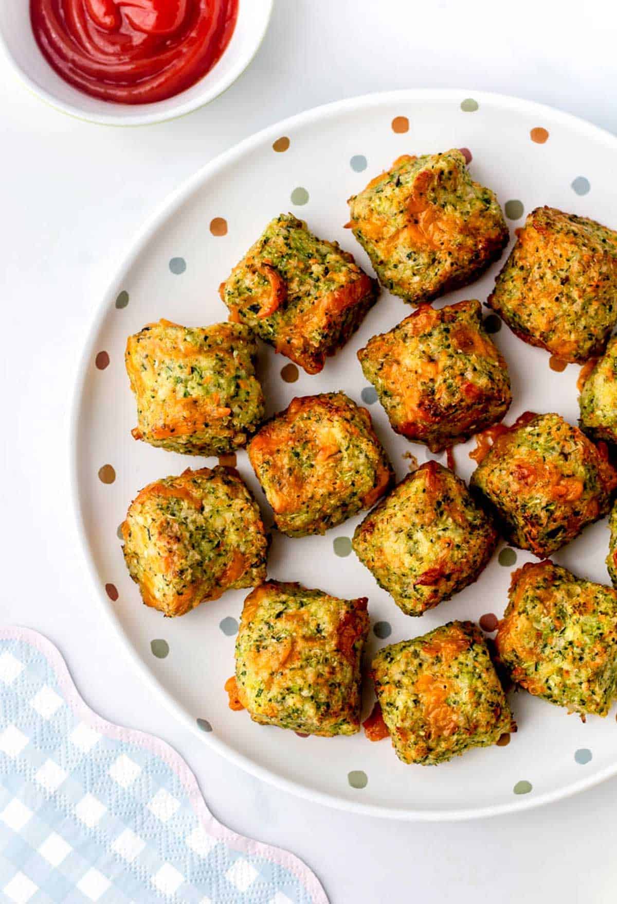 Homemade veggie tots on a polka dot plate.