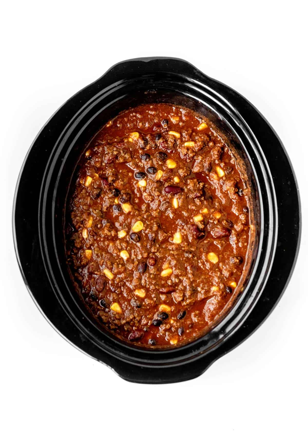 A birds-eye view of chili con carne in a slow cooker.