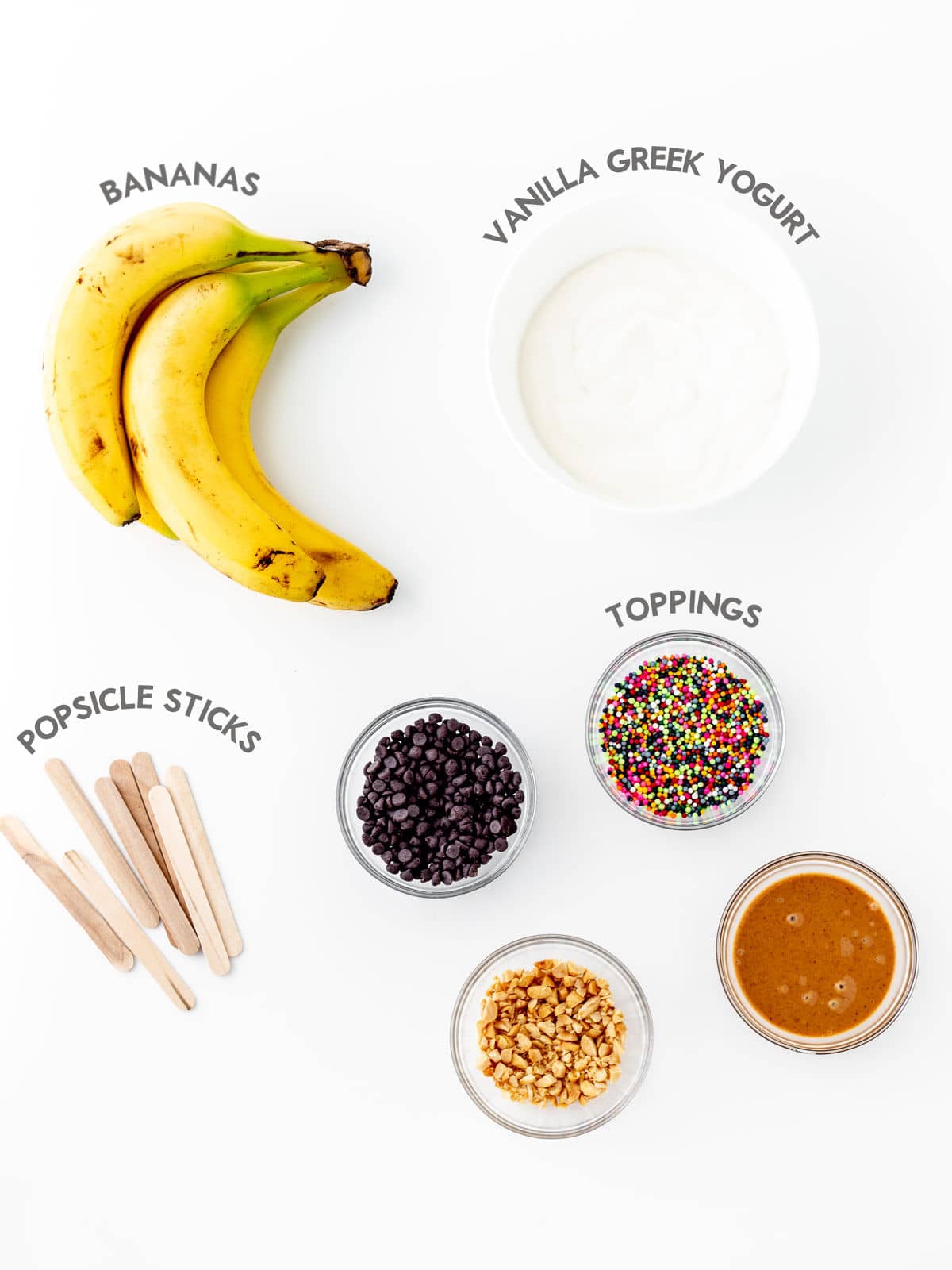 Ingredients to make frozen yogurt banana pops.