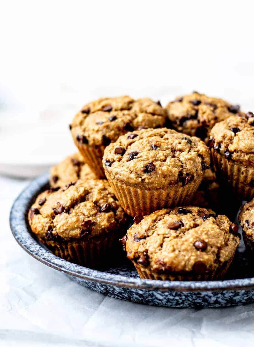 Banana protein muffins on a blue plate.