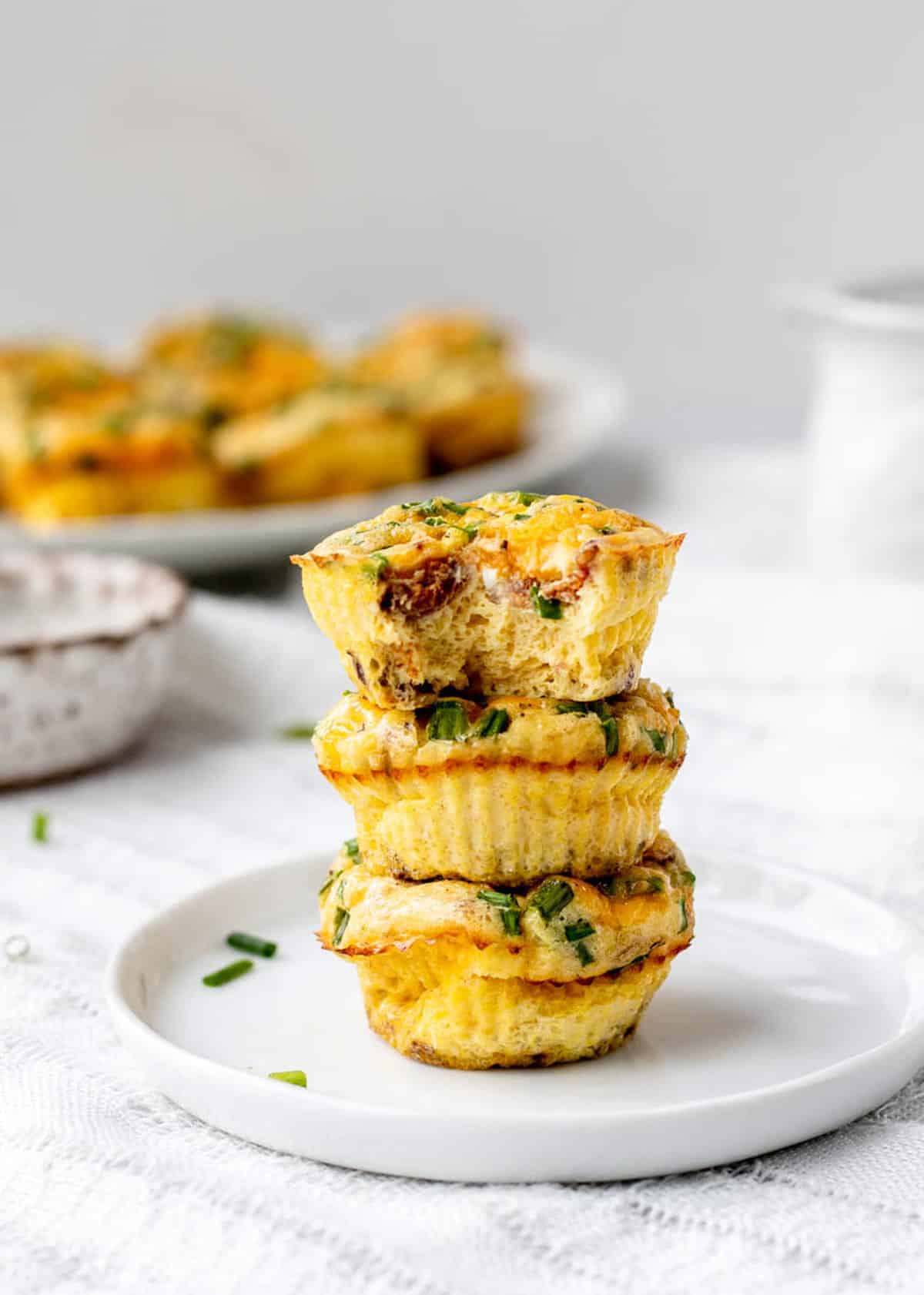 Mini crustless quiches stacked on top of each other.