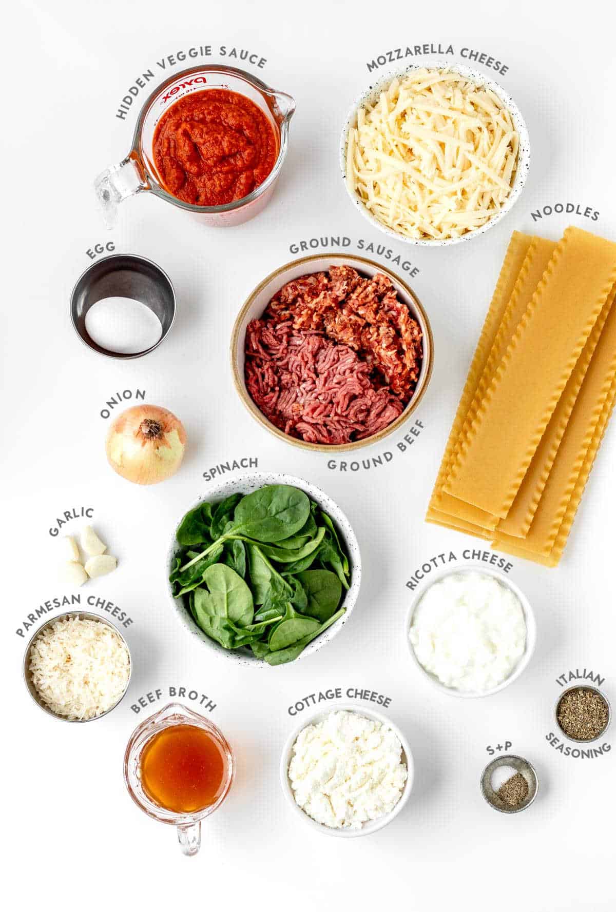 Ingredients required to make hidden veggie lasagna roll ups recipe with labels.