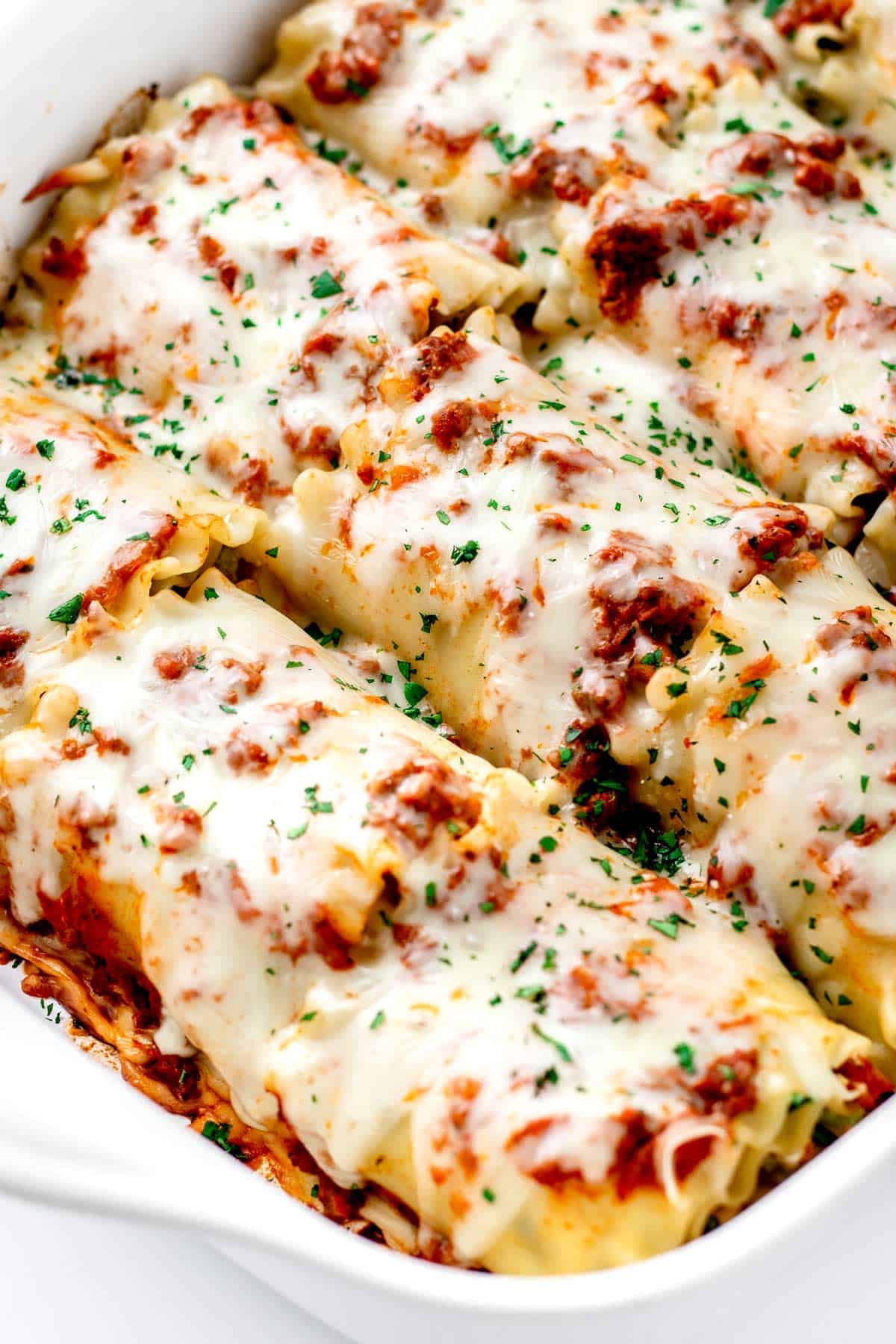 A close-up of the hidden veggie lasagna roll ups after baking.