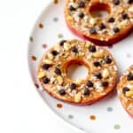 Close up image of apple slice cookies on a polka dot plate.