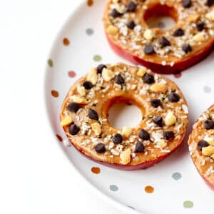 Close up image of apple slice cookies on a polka dot plate.