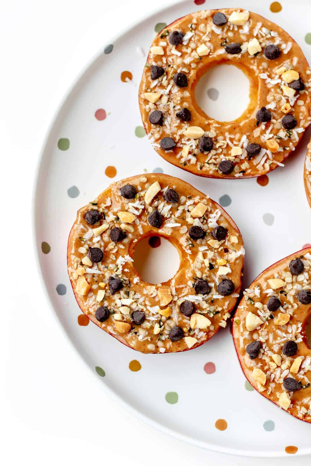 Fully assembled apple slice cookies on a polka dot plate.