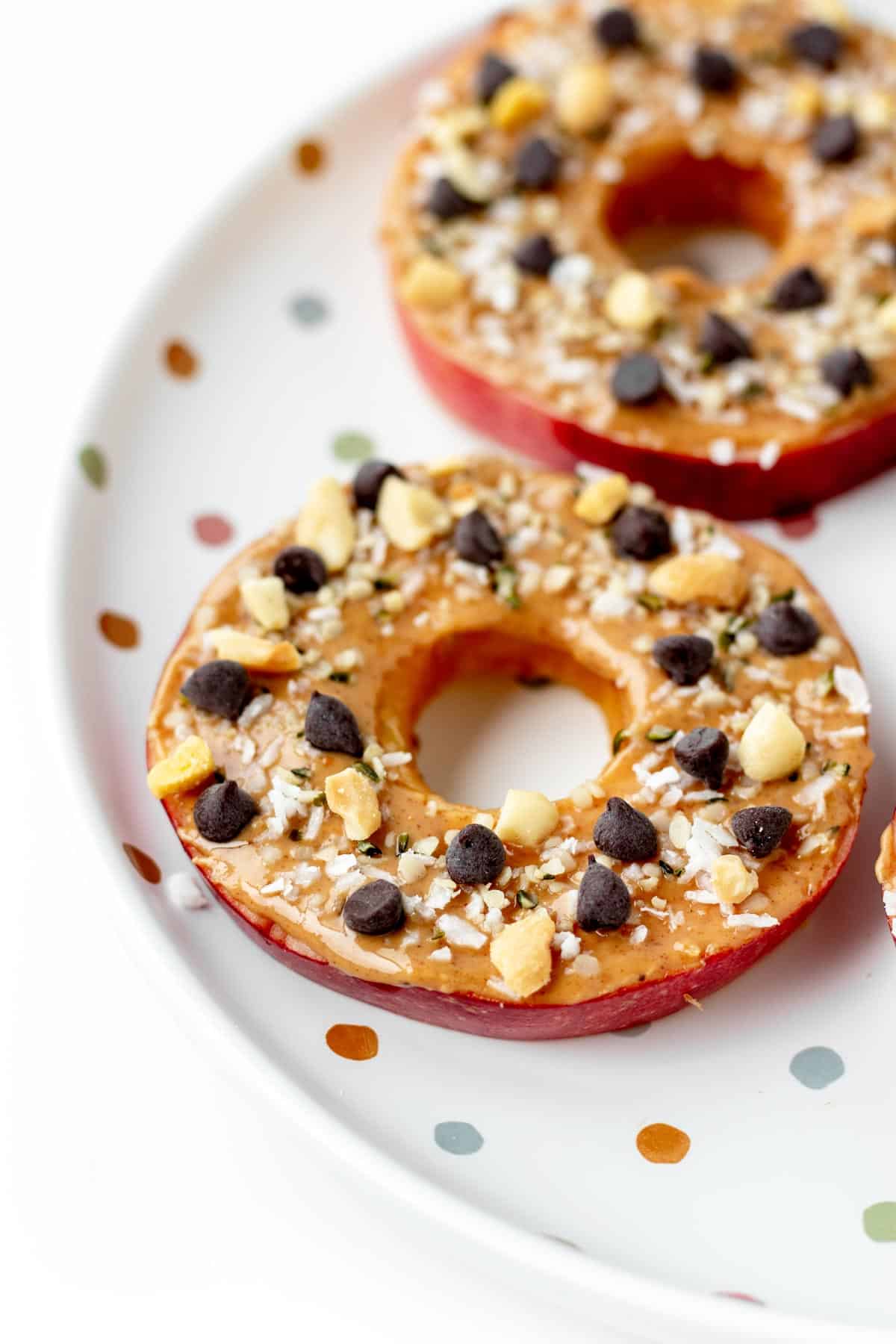 A close-up of an apple slice cookie on a plate.