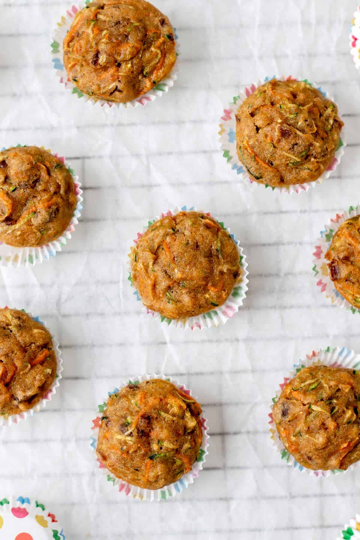 A birds-eye view of carrot zucchini banana muffins cooling.