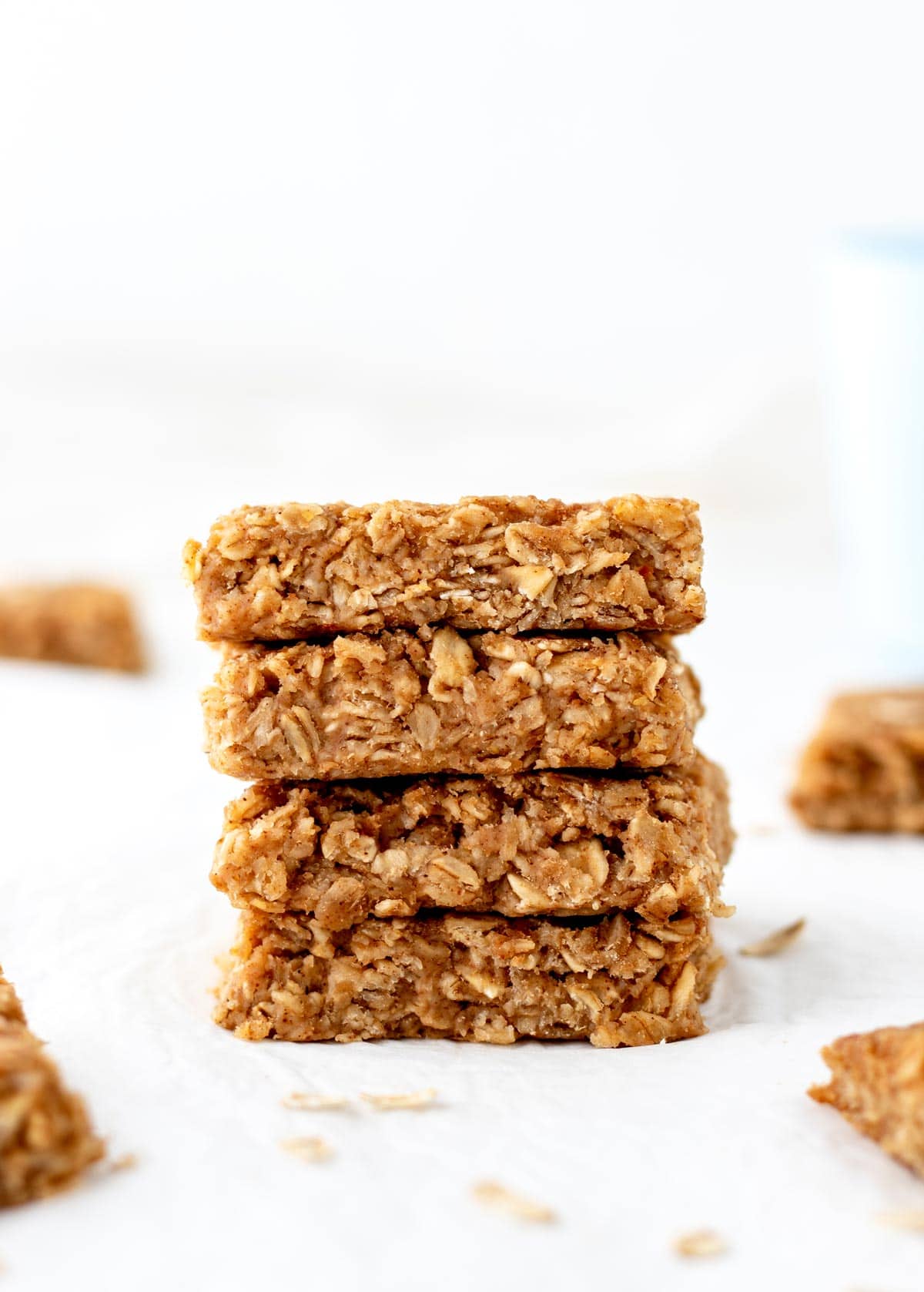 Apple peanut butter oatmeal bars stacked on top of one another.