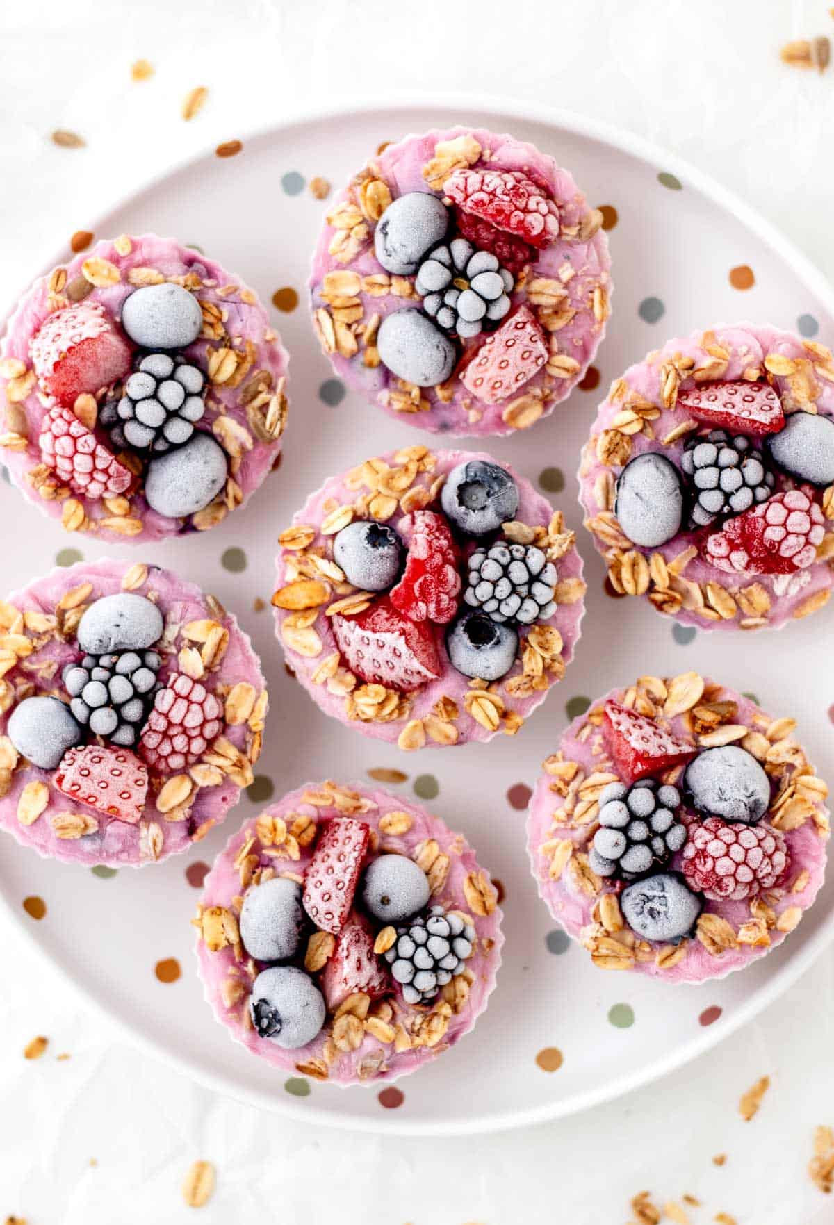 Frozen Greek yogurt bites on a polka dot plate.