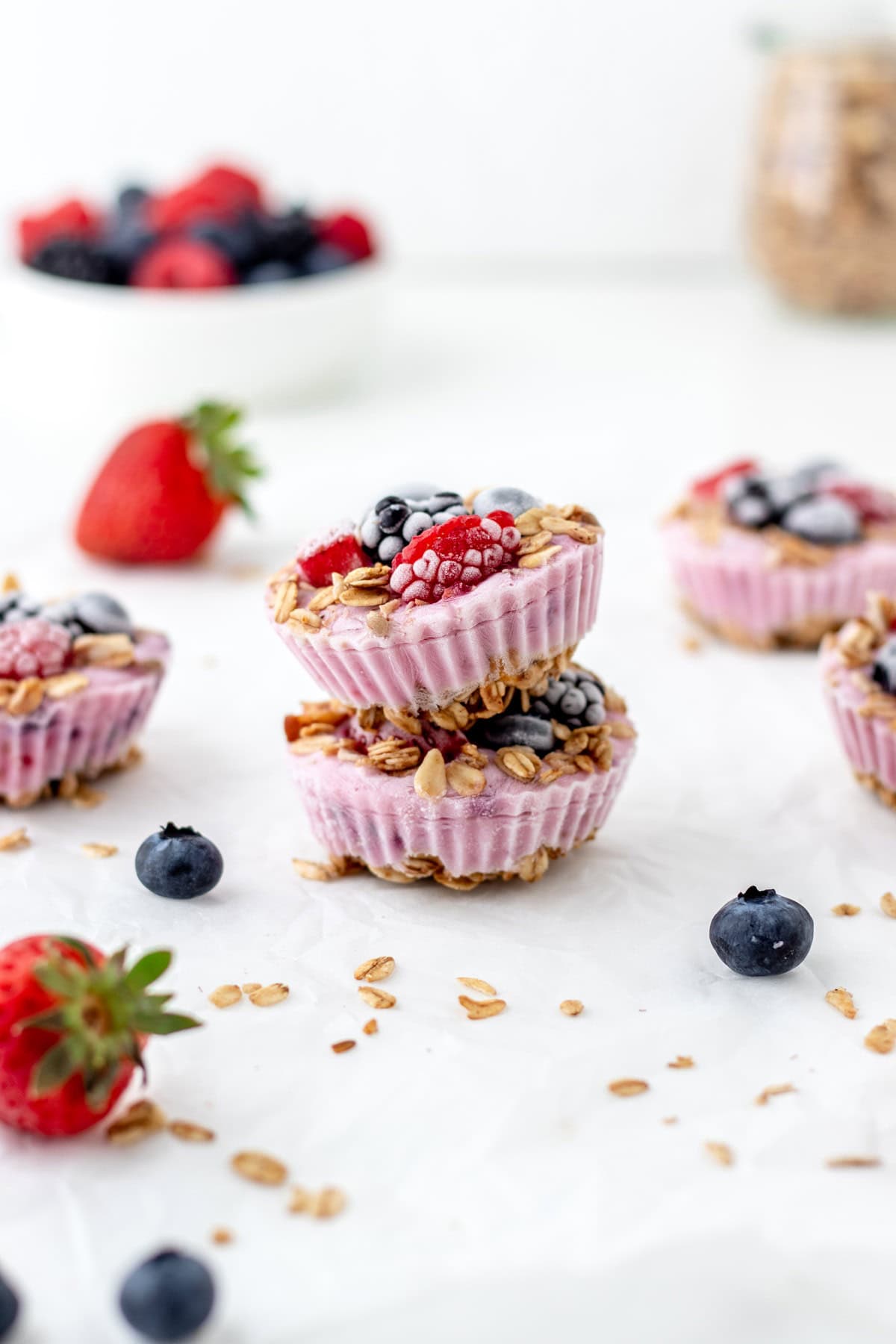 Two frozen Greek yogurt bites stacked on top of each other on a counter.