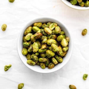 A small bowl of air fried edamame ready to serve.